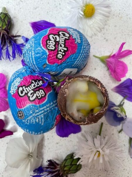 Displaying 3 of the new Creme Eggs and showing the inside of the egg