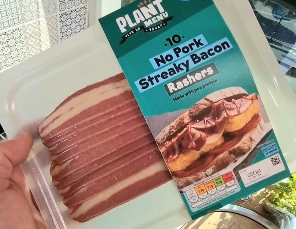 holding Aldi bacon pack