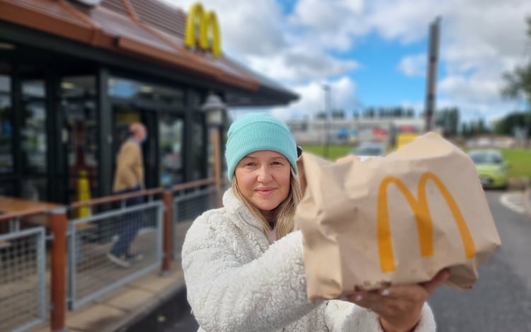 woman holding McDonald's bag