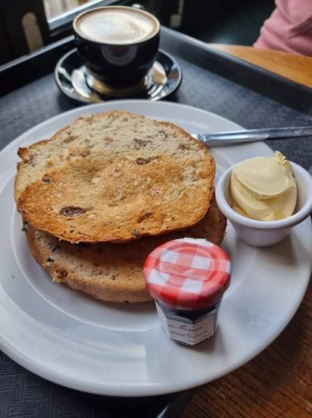 tea cake next to coffee jam and butter