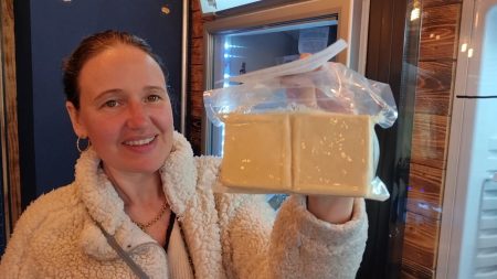 person holding two blocks of tofu